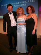 To collect the award. From L to R, Danny Waine, Helen Doyle & Suzie Jupp